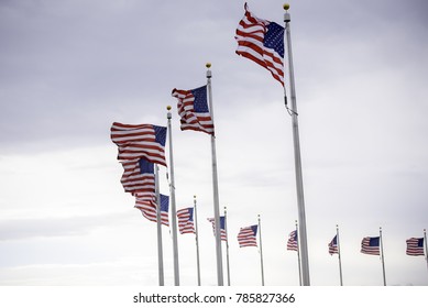 American flags on cloudy background