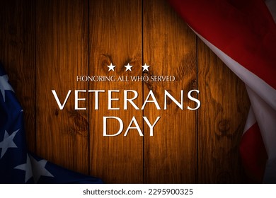 American flags with Text Veterans Day Honoring All Who Served on background. American holiday banner.