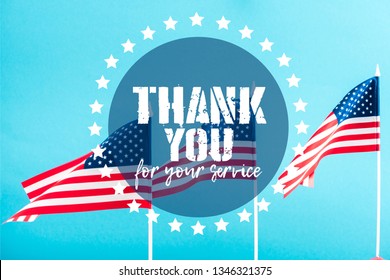 American Flags With Thank You For Your Service Lettering On Blue