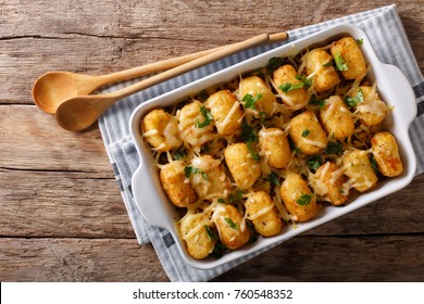 American Food: Tater Tots with cheese, meat, corn and parsley close-up in a baking dish on the table. horizontal top view from above - Shutterstock ID 760548352