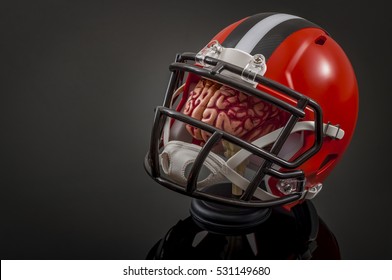 American Football Concussion Protocol Concept With A Brain Wearing A Football Helmet For Protection With Copy Space