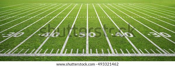 american football field and
grass