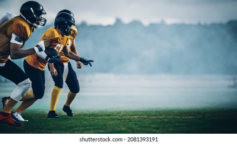 American Football Field Two Teams Compete: Players Pass And Run Attacking To Score Touchdown Points. Professional Athletes Compete For The Ball, Tackle, Fight For Victory.