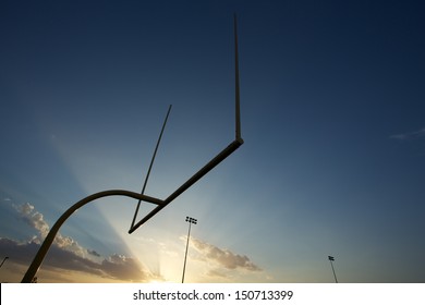 American Football Goal Posts Or Uprights At Sunset