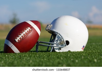 American Football and Helmet on the Field