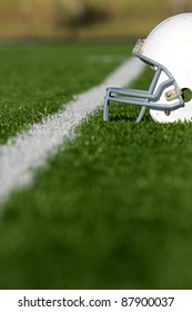 American Football Helmet On The Field With Room For Copy, Shot With Shallow Depth Of Field