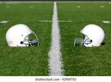 American Football Helmets On The Field With Room For Copy