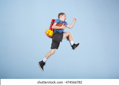 American Football Kid With Rocket Booster Backpack