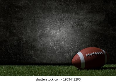 American football on green grass, on dark background. Team sport concept - Shutterstock ID 1903442293