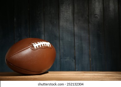 American Football On Wooden Table, Close Up