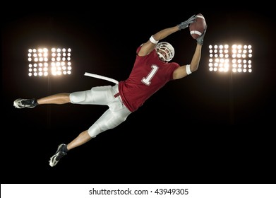 American Football Player In Action With Ball