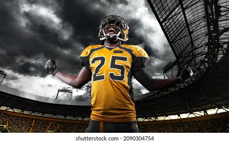 American Football Player, Athlete In Helmet With Ball On Stadium. Sport Wallpaper With Copyspace.