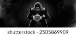 American football player banner on black background. Template for sports ads with copy space. Black and white photo