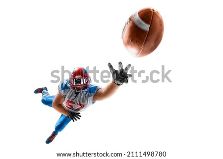 American football player catches the ball and flies in the air. Sportsman in action. Isolated on white background