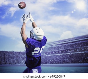 American Football Player Catching A Touchdown Pass In A Large Stadium.