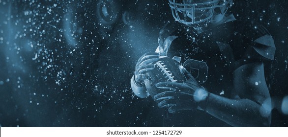 American football player in helmet holding rugby ball against close up of grunged wall - Powered by Shutterstock