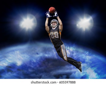 American football player jumps into the orbit to catch the ball. The shirt shows the lucky number 88. - Powered by Shutterstock