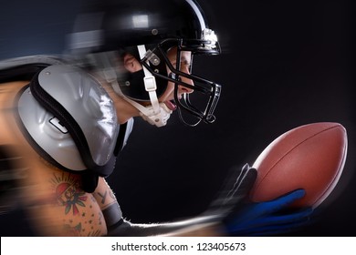 An American football player is participating in a game - Powered by Shutterstock