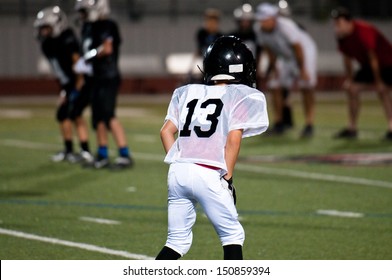 American football player in ready position. - Powered by Shutterstock