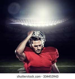 American football player in removing helmet against american football arena - Powered by Shutterstock