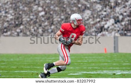 American Football Player running upfield