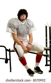 American Football Player. Sitting On Weight Bench.