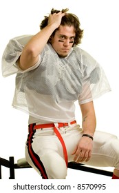 American Football Player. Sitting On Weight Bench.