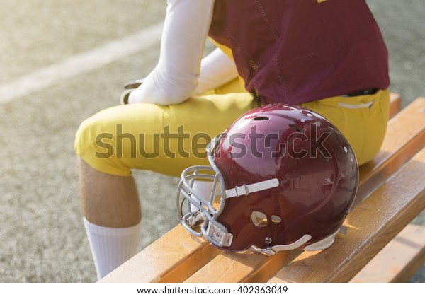 American Football Player Sitting On Bench Stock Photo Edit Now