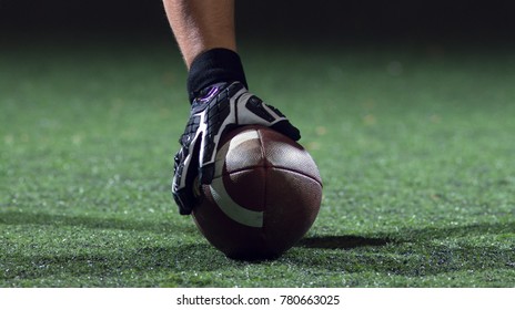 American Football Player Starting Football Game On American Football Field At Night