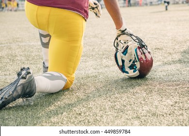 American football player waiting to join the game. - Powered by Shutterstock