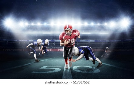 American football players in action on stadium with ball