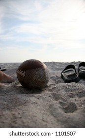 American Football In The Sand At The Beach