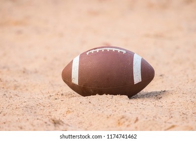 American Football In The Sand On The Beach 