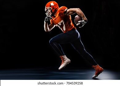 American Football Sportsman Player Runing On Black Background