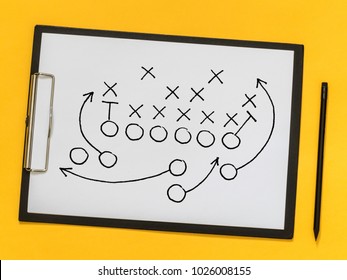 American football strategy, coaching, training. Game strategy. Scheme of the game on a sheet of paper - Powered by Shutterstock