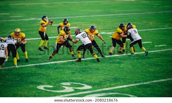 American\
Football Teams Start Game: Professional Players, Aggressive\
Face-off, Tackle, Pass, Fight for Ball and Score. Warrior\
Competition Full of Brutal Energy, Power,\
Skill.