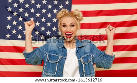 American girl. Portrait of Happy of young surprised woman on USA flag  background. Funny human face. Patriotism concept