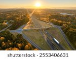 American highway bridge with fast moving traffic area in evening. Interstate transportation concept