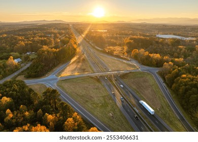 American highway bridge with fast moving traffic area in evening. Interstate transportation concept - Powered by Shutterstock