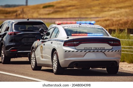 American Highway State Trooper Pulling Over Vehicle For Speeding Reason. - Shutterstock ID 2048004398
