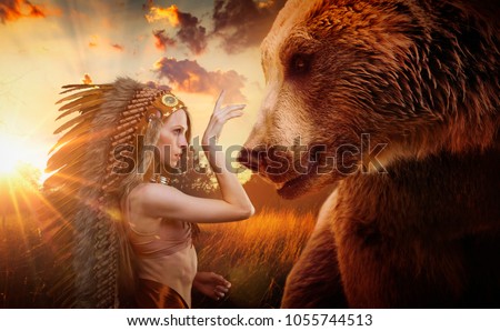 American Indian with plume of feathers next to a brown bear, concept of peace and balance with nature, environment and care of the planet earth