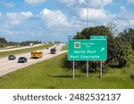 American interstate highway directional exit sign on fast motorway in Florida, USA. I-75 freeway junction leading to North Port and Port Charlotte