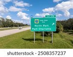 American interstate highway directional exit sign on fast motorway in Florida, USA. I-75 freeway junction leading to North Port and Port Charlotte