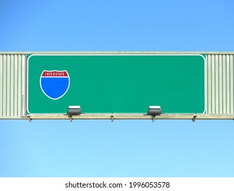 American Interstate Highway Overhead Road Sign. Blue Sky Background