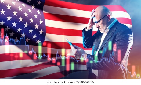 American investor. Man with tablet grabs his head. Businessman near American flag. Businessman from USA went bankrupt. Losses in US financial market. Bankruptcy company in United States of America