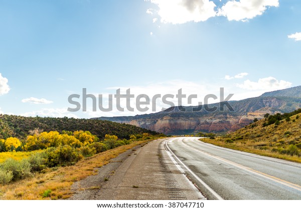 American landscape long endless asphalt north\
american mountain road in beautiful sunny autumn weather somewhere\
in the USA