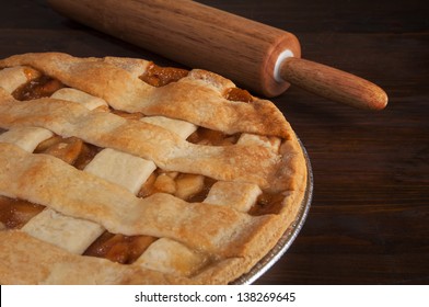 American  Lattice Crust Apple Pie With Dough Roller