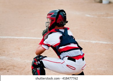 American Little League Baseball Catcher  Behind Home Plate.