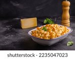 American mac and cheese, macaroni pasta in cheesy sauce.