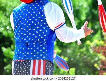 American Male Juggler Performing In A Parade For The Holiday.